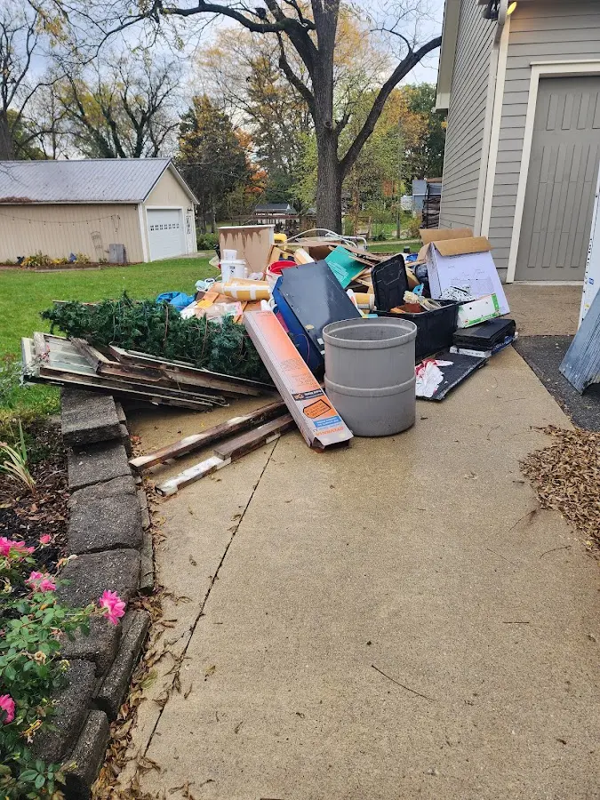 Dumpster being loaded with debris for 3 Yard Dumpster Rental in Mount Carmel